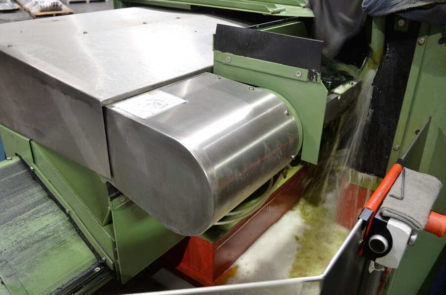 Close-up of the wet bevel-grinding process