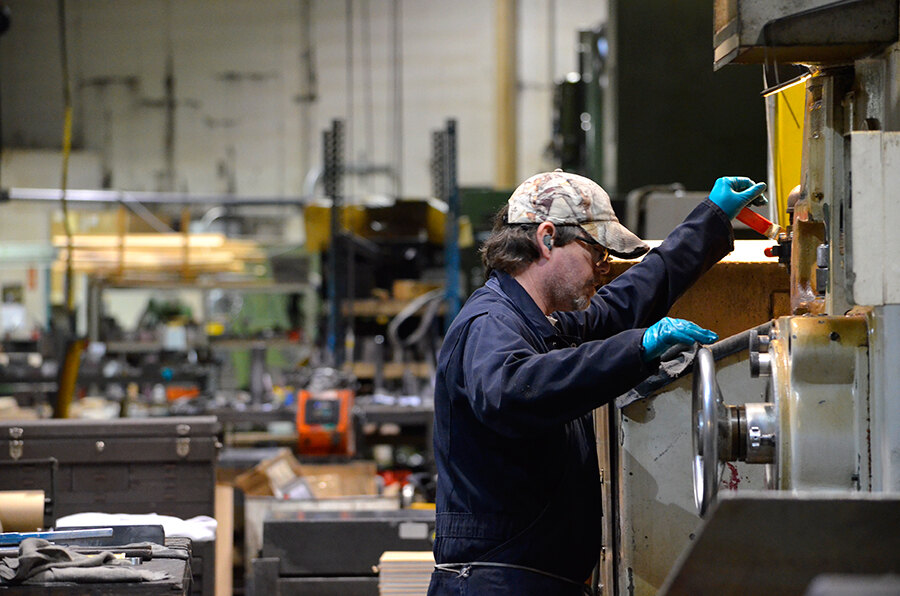 Larkin Precision operator working at a Blanchard grinder